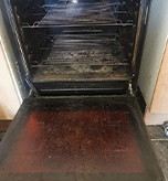 Grimy and soiled oven before cleaning